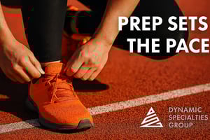 Runner tying shoes at the starting line with text ‘Prep Sets the Pace’ and Dynamic Specialties Group logo, symbolizing Salesforce project discovery and preparation.